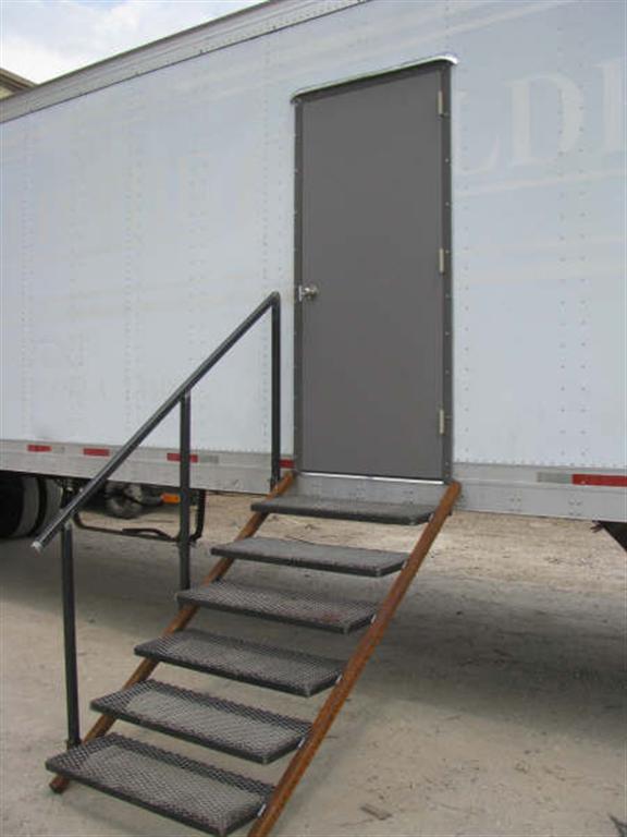 Elevated Stairs to a Custom Door on a shipping contianer