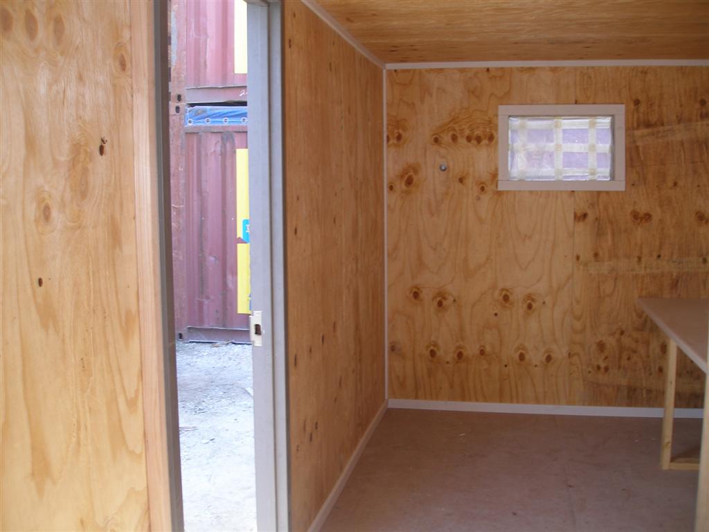Office space with wood paneling, custom shipping container